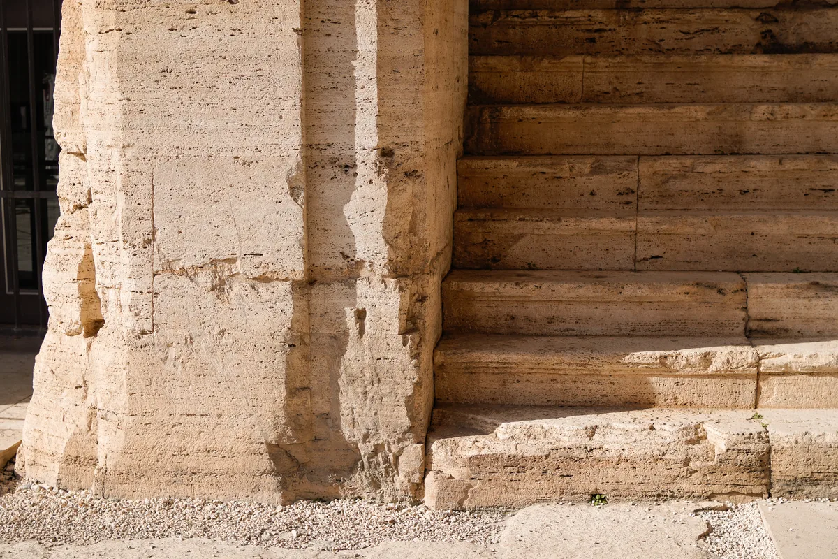 Weathered stone blocks and worn steps, close up